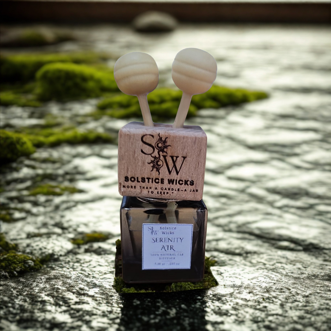 Vent clip air car diffuser labeled “Serenity Air” with lemon slices, lavender sprigs, and eucalyptus leaves — fresh and calming essential oil blend for cars.