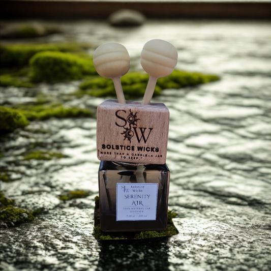 Vent clip air car diffuser labeled “Serenity Air” with lemon slices, lavender sprigs, and eucalyptus leaves — fresh and calming essential oil blend for cars.